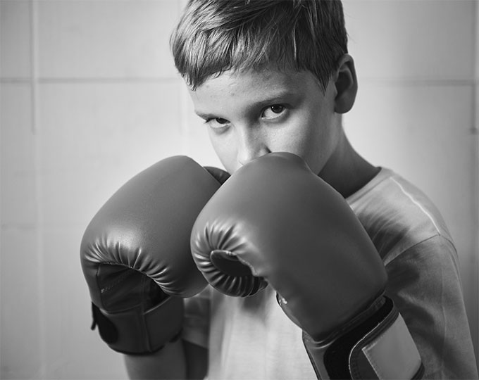 Krav Maga Bangkok Self-Defense Kids wearing boxing gloves for Krav Maga Bangkok basics class